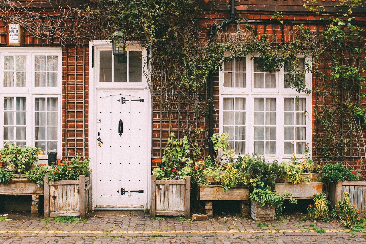 Quaint brick house with plants